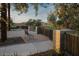 Brick picnic area with stone retaining wall, wrought iron fence and mature trees offers shade in this community at 2232 W Chisum Trl, Phoenix, AZ 85085