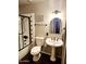 Well-lit bathroom featuring shower, toilet, and single sink with vanity at 2349 W Shaw Butte Dr, Phoenix, AZ 85029