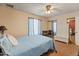 A spacious bedroom with mirrored closet doors and coordinating curtains at 2349 W Shaw Butte Dr, Phoenix, AZ 85029
