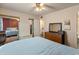 A light filled bedroom with mirrored closet doors and space for storage at 2349 W Shaw Butte Dr, Phoenix, AZ 85029