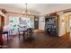 Bright dining room with dark wood floors and large window at 2349 W Shaw Butte Dr, Phoenix, AZ 85029