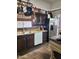 Traditional kitchen featuring stainless steel appliances, dark wood cabinetry and granite countertops at 2349 W Shaw Butte Dr, Phoenix, AZ 85029