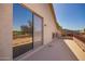 The balcony has a large sliding glass door to the home and overlooks the neighborhood at 2602 E Glass Ln, Phoenix, AZ 85042