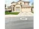 Charming two-story home with a well-manicured lawn and attached two-car garage and desert landscaping at 2602 E Glass Ln, Phoenix, AZ 85042