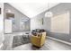 Bright living room with high ceilings, large windows, modern decor, and stylish hardwood floors at 2602 E Glass Ln, Phoenix, AZ 85042