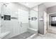 Updated shower features light tile and glass shower door at 2602 E Glass Ln, Phoenix, AZ 85042