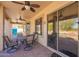 Covered patio with outdoor seating, views of the pool, and access to the backyard at 2602 E Glass Ln, Phoenix, AZ 85042