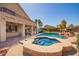 Inviting pool and spa with lush landscaping and a spacious patio area at 2602 E Glass Ln, Phoenix, AZ 85042