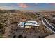 Aerial view captures the essence of desert living, highlighting the pool and modern architecture at 26885 N 87Th Dr, Peoria, AZ 85383