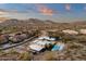 Spectacular aerial view of a luxury home, pool, and desert landscape showcasing the community at 26885 N 87Th Dr, Peoria, AZ 85383