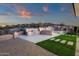 Outdoor kitchen featuring stainless steel appliances, countertop space, and seating, perfect for entertaining at 26885 N 87Th Dr, Peoria, AZ 85383