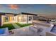An outdoor firepit area and lounge area offer a space to gather and enjoy the mountain views at 26885 N 87Th Dr, Peoria, AZ 85383
