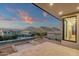 Balcony view of the community and local mountains with views of the sink, cabinets, and window at 26885 N 87Th Dr, Peoria, AZ 85383