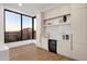 Bar area with wine cooler, large window, and scenic mountain views at 26885 N 87Th Dr, Peoria, AZ 85383