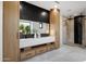 Bathroom featuring modern vanity with a stylish mirror, cabinets and a glass enclosed shower at 26885 N 87Th Dr, Peoria, AZ 85383