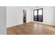 Bright bedroom with hardwood floors, white walls and large window overlooking the neighborhood at 26885 N 87Th Dr, Peoria, AZ 85383