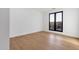 Bright bedroom with hardwood floors, white walls and large window overlooking the neighborhood at 26885 N 87Th Dr, Peoria, AZ 85383