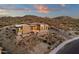 Expansive desert home featuring a modern design with stacked stone accents and ample privacy at 26885 N 87Th Dr, Peoria, AZ 85383