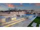An inground pool and attached spa are lit with modern fixtures to enhance the mood at 26885 N 87Th Dr, Peoria, AZ 85383