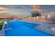 A relaxing in-ground pool and jacuzzi provide a luxurious outdoor retreat with stunning views at 26885 N 87Th Dr, Peoria, AZ 85383