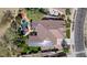 Aerial view of a home with solar panels, a lush backyard, and a private pool with a spa at 27016 N 20Th Ln, Phoenix, AZ 85085