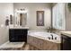 Serene bathroom with a soaking tub, neutral color palette, and ample natural light at 27016 N 20Th Ln, Phoenix, AZ 85085