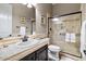 Bathroom featuring walk-in shower with glass door, tile surround and a vanity with stone countertops at 27016 N 20Th Ln, Phoenix, AZ 85085
