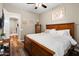 Bedroom featuring dark wood floor, a light colored bed, a window and dark dresser at 27016 N 20Th Ln, Phoenix, AZ 85085