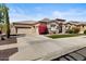 Charming single-story home with a two-car garage, manicured landscaping and a beautiful tiled roof at 27016 N 20Th Ln, Phoenix, AZ 85085