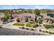 Well manicured single Gathering home featuring desert landscaping, lawn and paver driveway at 27016 N 20Th Ln, Phoenix, AZ 85085