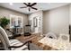 Flex space featuring wood floors, light paint, a window, chair and exercise equipment at 27016 N 20Th Ln, Phoenix, AZ 85085