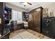 Functional home office with built in shelves, desk, and an integrated murphy bed at 27016 N 20Th Ln, Phoenix, AZ 85085