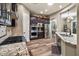 Spacious kitchen featuring stainless steel appliances, granite countertops and dark wood cabinets at 27016 N 20Th Ln, Phoenix, AZ 85085