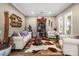 Comfortable living room with stylish decor, neutral paint, beautiful floors, and bright natural light at 27016 N 20Th Ln, Phoenix, AZ 85085