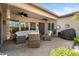 Covered patio furnished with comfortable seating, ceiling fans, and decorative accents, offering an ideal outdoor living space at 27016 N 20Th Ln, Phoenix, AZ 85085