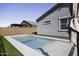 Relaxing backyard with a refreshing pool and artificial turf, perfect for outdoor enjoyment at 281 S San Gregorio Ln, Casa Grande, AZ 85194