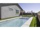 Stunning backyard pool with artificial grass and safety fence, ideal for Gathering fun and relaxation at 281 S San Gregorio Ln, Casa Grande, AZ 85194
