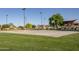 A community basketball court with beautiful, green landscaping at 281 S San Gregorio Ln, Casa Grande, AZ 85194