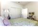 A beautifully decorated interior bedroom shot with an accent wall and natural light at 281 S San Gregorio Ln, Casa Grande, AZ 85194