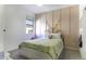 A decorated interior bedroom shot with a patterned bedspread and natural light at 281 S San Gregorio Ln, Casa Grande, AZ 85194