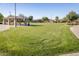 A community common area with covered seating and landscaping at 281 S San Gregorio Ln, Casa Grande, AZ 85194