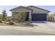 Inviting single-story home featuring a two-car garage, a covered entry, and desert-friendly landscaping at 281 S San Gregorio Ln, Casa Grande, AZ 85194