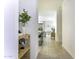 Hallway with open view to seating area, neutral tile floors, decorated shelves with plants and decorations at 281 S San Gregorio Ln, Casa Grande, AZ 85194