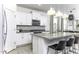 Modern kitchen features granite countertops, stainless appliances, and white cabinets at 281 S San Gregorio Ln, Casa Grande, AZ 85194