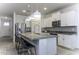 Bright kitchen with granite counters, stainless steel appliances, and a breakfast bar at 281 S San Gregorio Ln, Casa Grande, AZ 85194