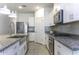 Stylish kitchen featuring granite countertops, stainless steel appliances, and tile flooring at 281 S San Gregorio Ln, Casa Grande, AZ 85194