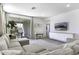 Bright living room with modern furniture and neutral tones, featuring a large sliding glass door to the patio at 281 S San Gregorio Ln, Casa Grande, AZ 85194