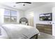 Bright main bedroom featuring modern furnishings and a television at 281 S San Gregorio Ln, Casa Grande, AZ 85194