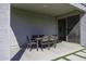 Covered patio with outdoor dining area and access to the backyard at 281 S San Gregorio Ln, Casa Grande, AZ 85194