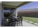 Inviting covered patio area with outdoor dining set and access to the backyard at 281 S San Gregorio Ln, Casa Grande, AZ 85194